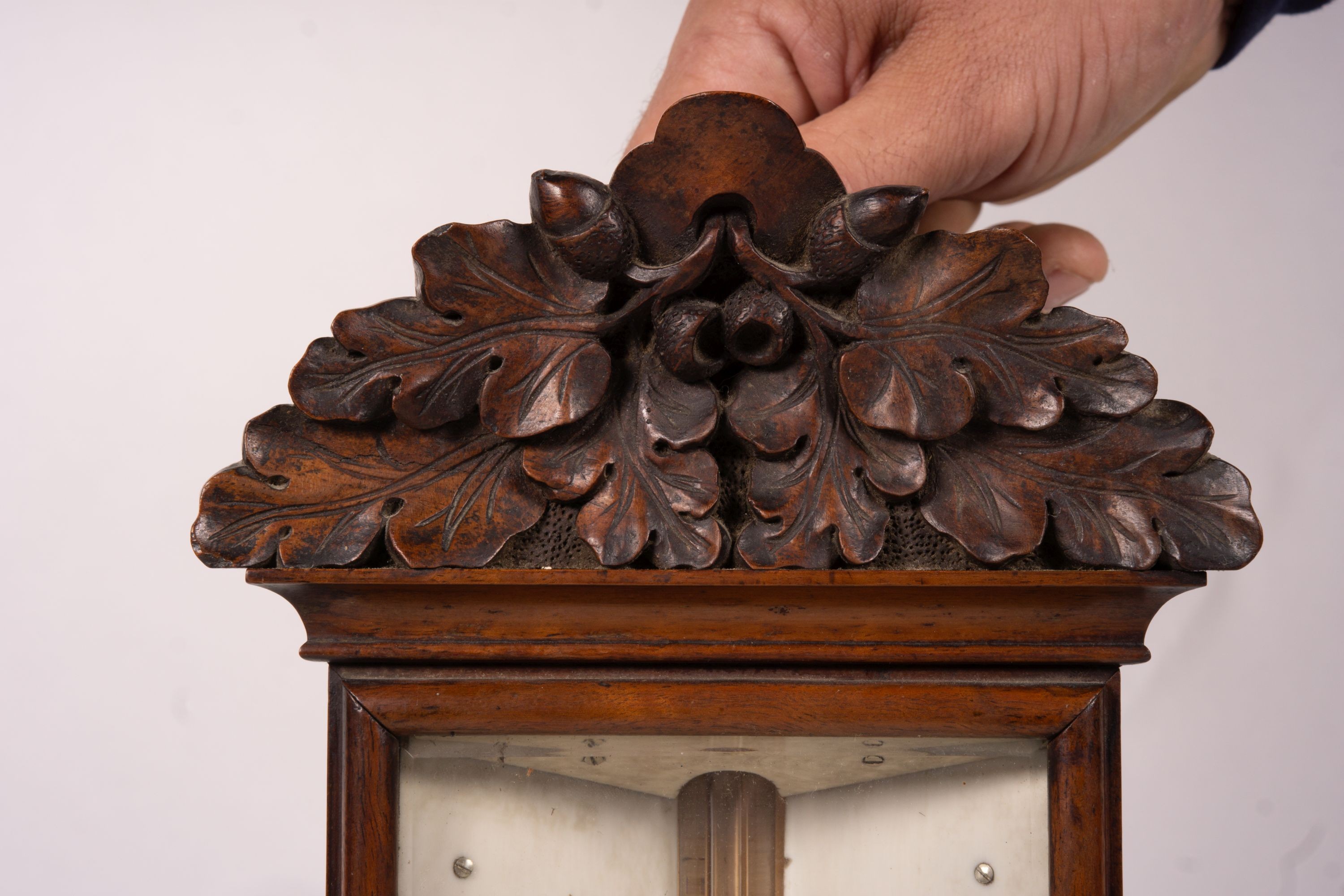 A Victorian carved walnut stick barometer by Chadburn Bros., Sheffield, height 104cm